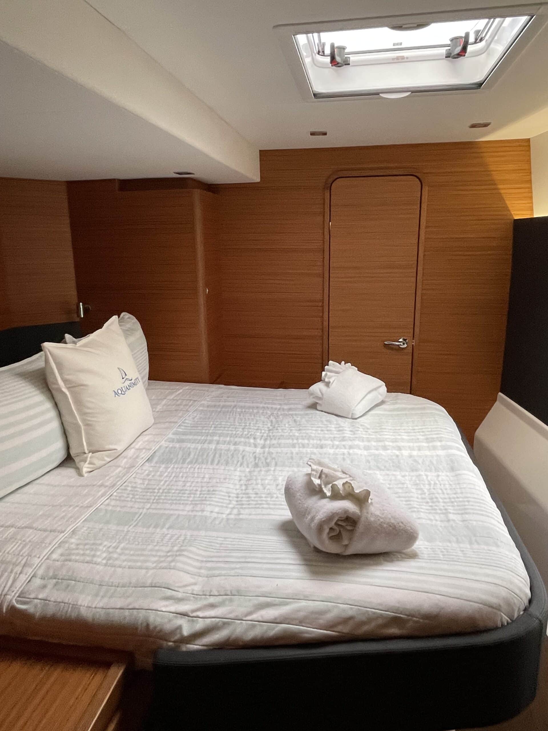 Forward queen guest cabin aboard Aquanimity Dufour 48 catamaran charter in the British Virgin Islands