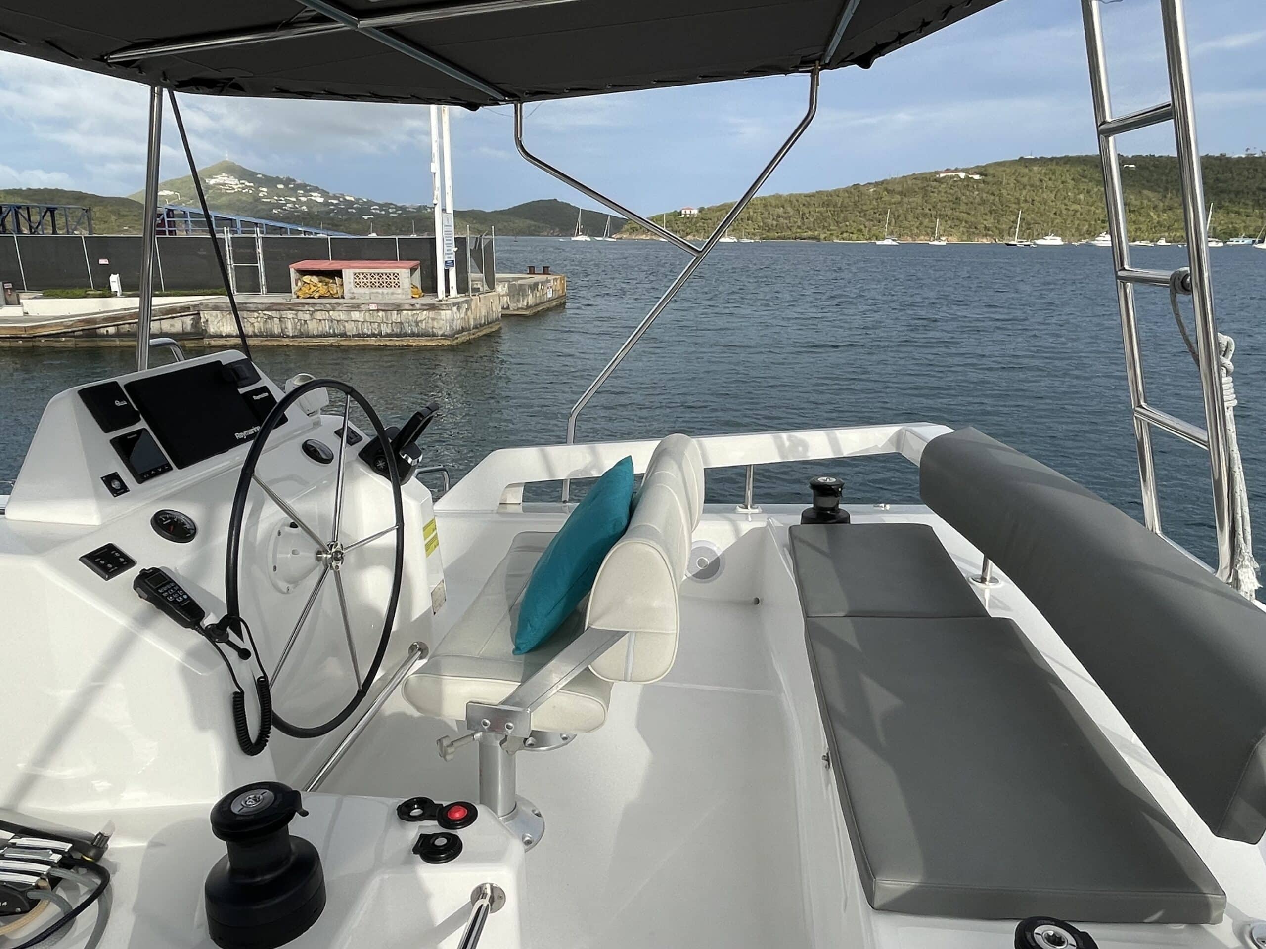 Elevated flybridge helm and lounge aboard Aquanimity Dufour 48 catamaran