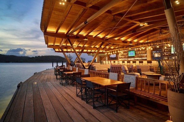 Saba Rock bar and restaurant at dusk during an Aquanimity catamaran charter