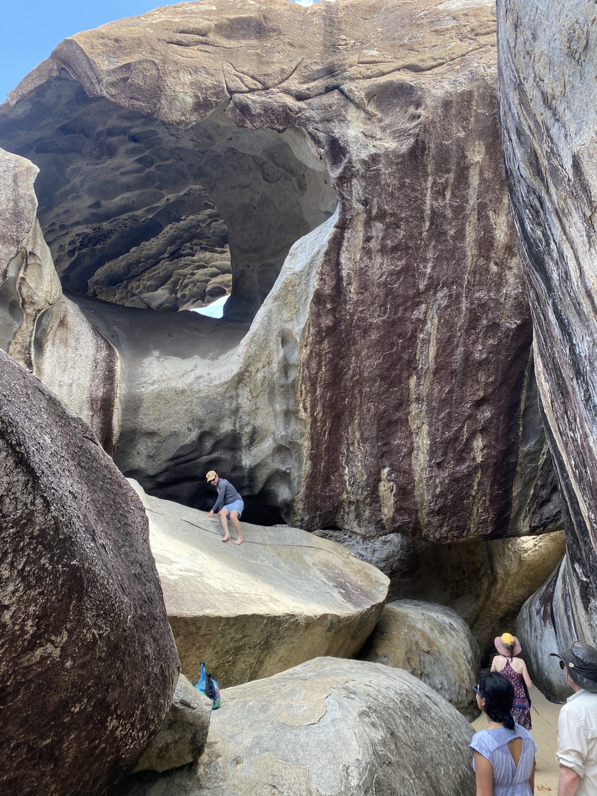 Guests exploring The Baths granite boulders on Virgin Gorda